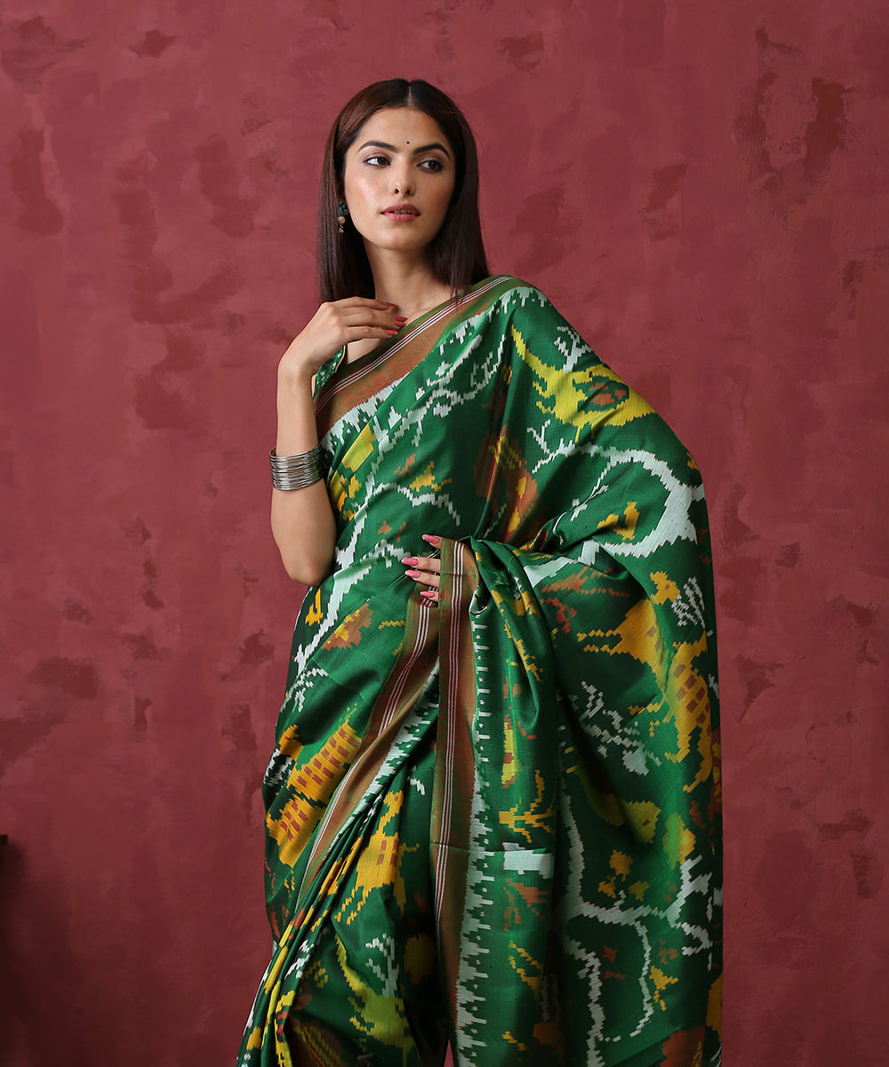 Green_Handloom_Mulberry_Silk_Patola_Saree_With_Animal_Motif_WeaverStory_01