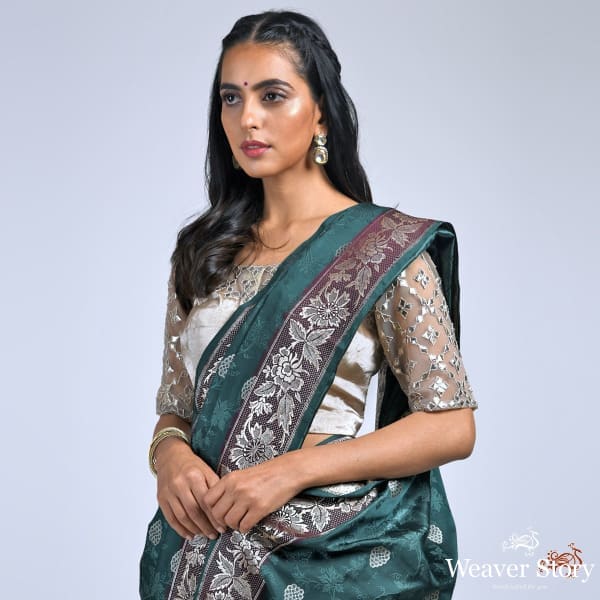 Bottle_green_and_wine_Banarasi_Tanchoi_saree_with_a_parsi_gara_weave_border_WeaverStory_01