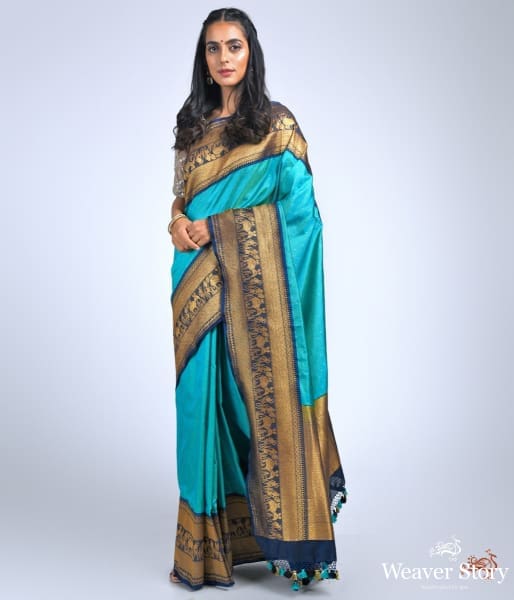 Teal_green_ektara_saree_with_navy_border_with_warli_art_weave_WeaverStory_02