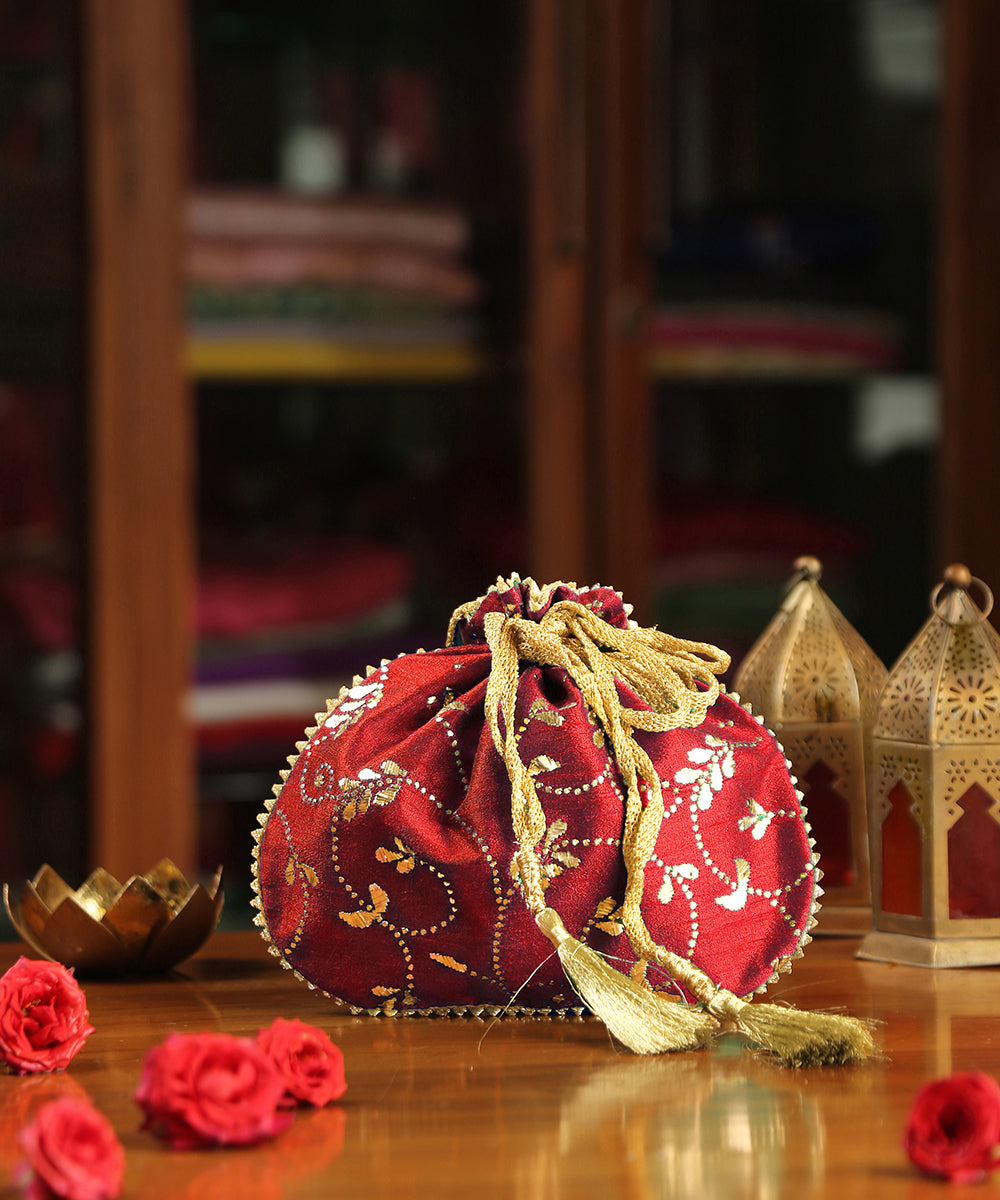 Red_Hand_Embroidered_Raw_Silk_Potli_With_Golden_Leaf_Hand_Embroidery_WeaverStory_01