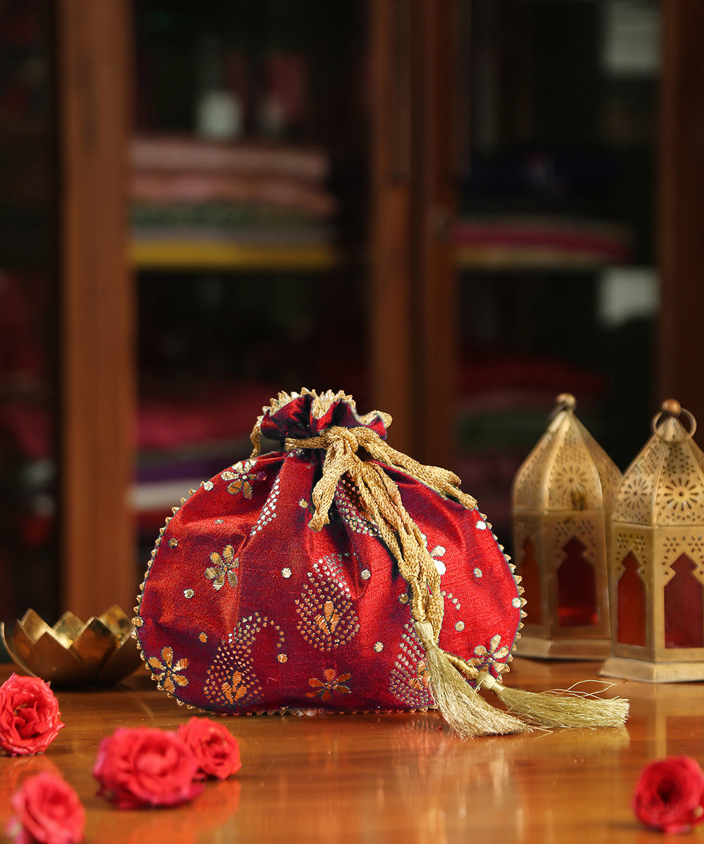 Red_Raw_Silk_Hand_Embroidered_Potli_With_Golden_Paisley_And_Flower_Design_WeaverStory_01