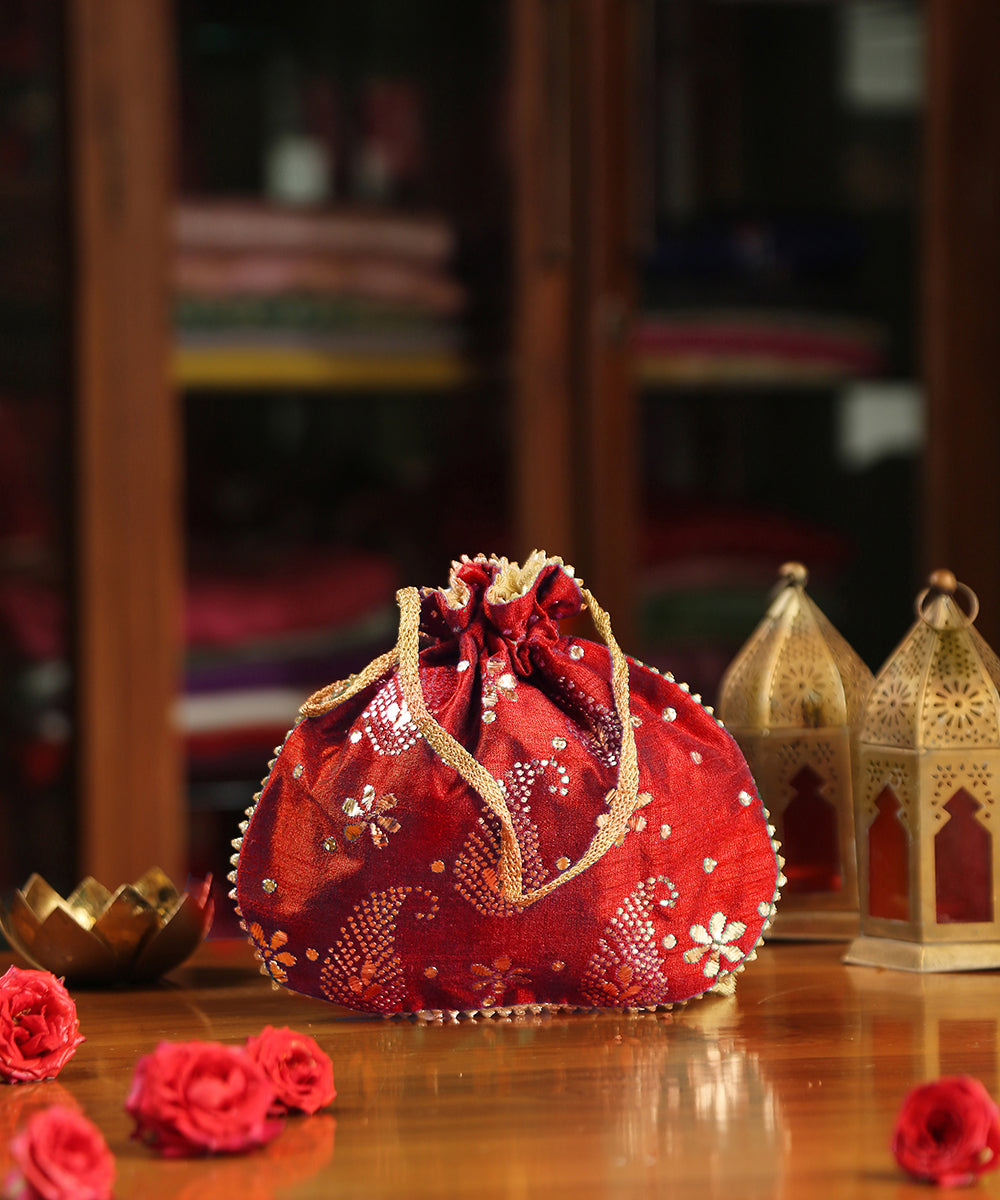 Red_Raw_Silk_Hand_Embroidered_Potli_With_Golden_Paisley_And_Flower_Design_WeaverStory_02