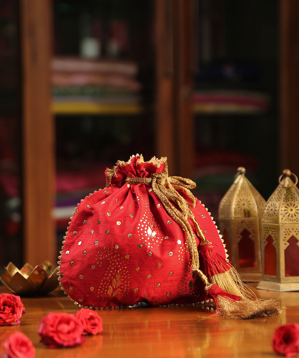 Red_Raw_Silk_Hand_Embroidered_Potli_With_Golden_Dots_And_Paisley_Design_WeaverStory_01