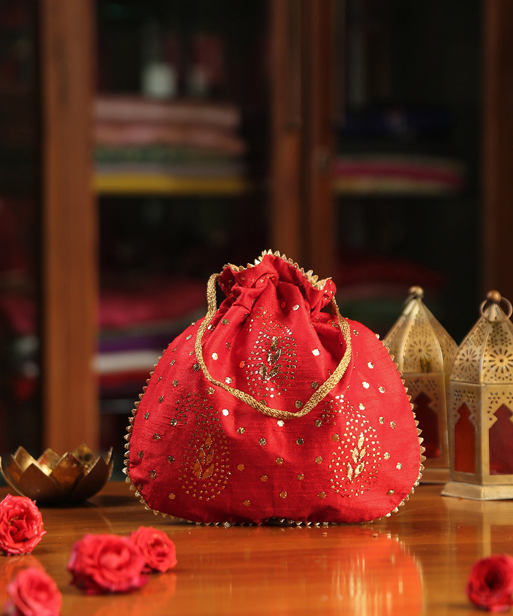 Red_Raw_Silk_Hand_Embroidered_Potli_With_Golden_Dots_And_Paisley_Design_WeaverStory_02