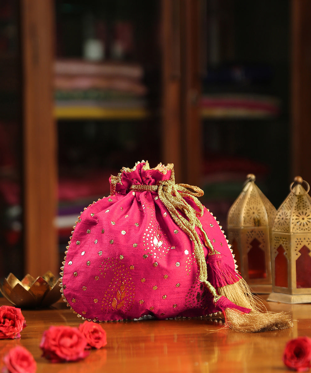 Magenta_Pink_Raw_Silk_Potli_With_Golden_Dots_And_Paisley_Design_WeaverStory_01