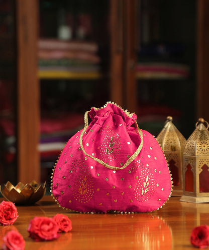 Magenta_Pink_Raw_Silk_Potli_With_Golden_Dots_And_Paisley_Design_WeaverStory_02