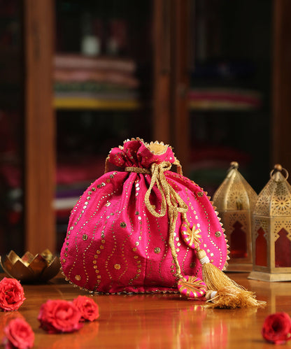 Magenta_Hand_Embroidered_Raw_Silk_Potli_With_Golden_Sequins_WeaverStory_01