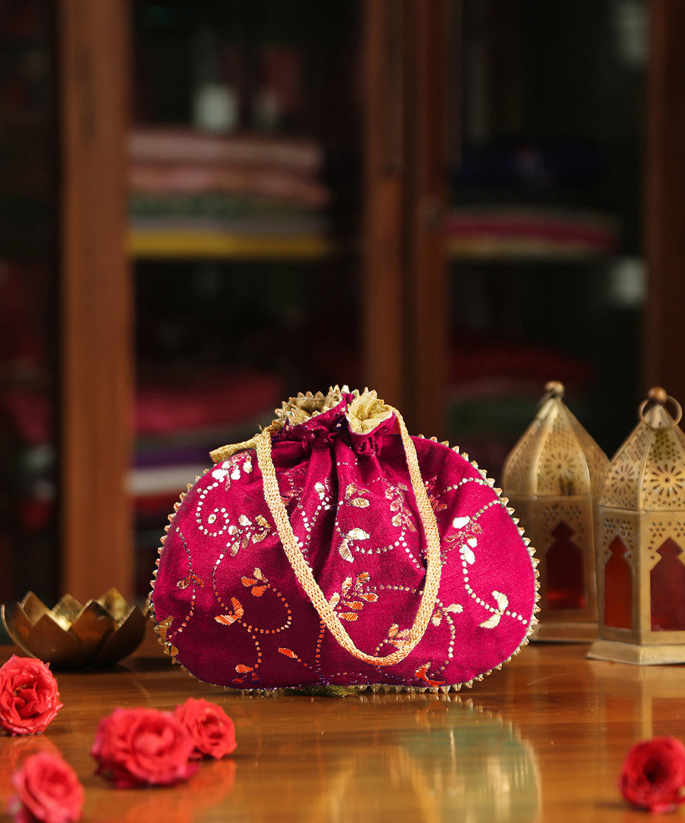 Magenta_Hand_Embroidered_Raw_Silk_Potli_With_Golden_Bel_And_Leaf_Work_WeaverStory_02