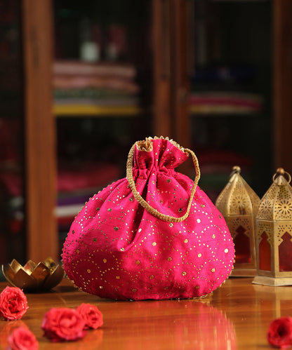 Magenta_Raw_Silk_Hand_Embroidered_Potli_With_Golden_Sequins_All_Over_WeaverStory_02