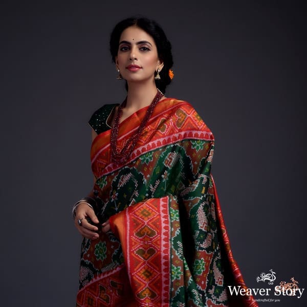 Pure_silk_Gujarat_Patola_saree_in_Green_with_red_combination_and_large_fish_motifs_WeaverStory_01