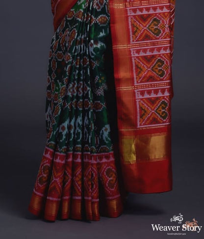 Pure_silk_Gujarat_Patola_saree_in_emerald_green_and_red_with_horse,_swan_and_fish_motifs_WeaverStory_04