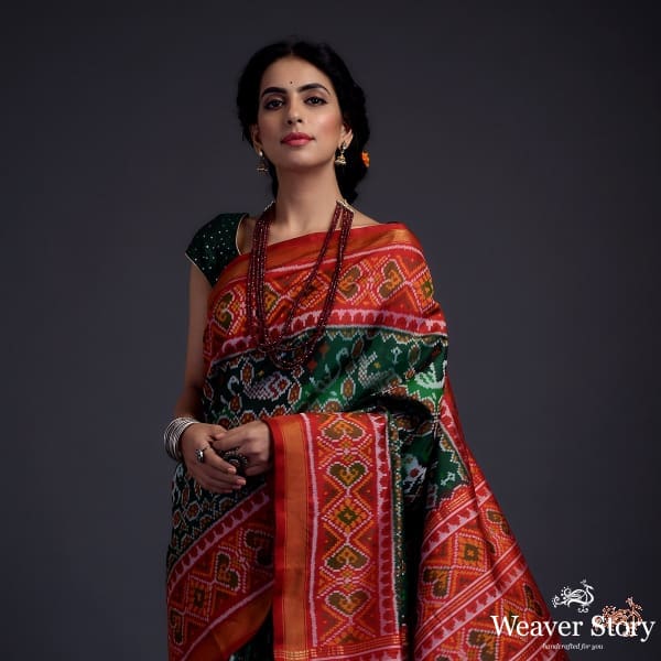 Pure_silk_Gujarat_Patola_saree_in_emerald_green_and_red_with_horse,_swan_and_fish_motifs_WeaverStory_01