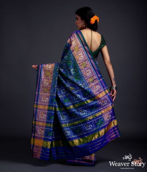 Blue_dual_tone_single_ikat_patola_saree_with_a_purple_and_gold_tissue_border_WeaverStory_03