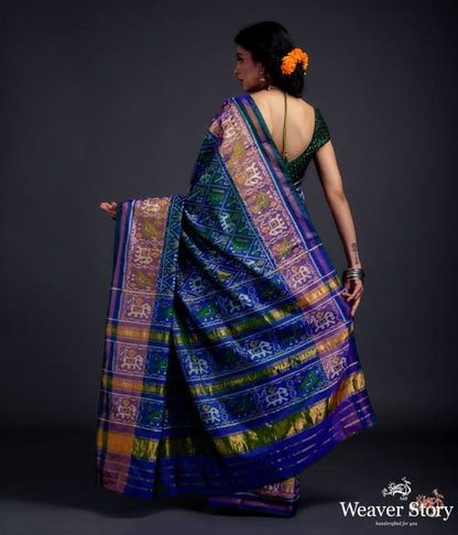 Blue_dual_tone_single_ikat_patola_saree_with_a_purple_and_gold_tissue_border_WeaverStory_03