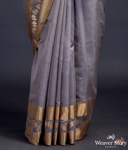 Grey_chanderi_silk_saree_with_gold_zari_floral_motifs_on_pallu_and_broad_gold_border_WeaverStory_04